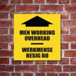 Men Working Overhead Sign